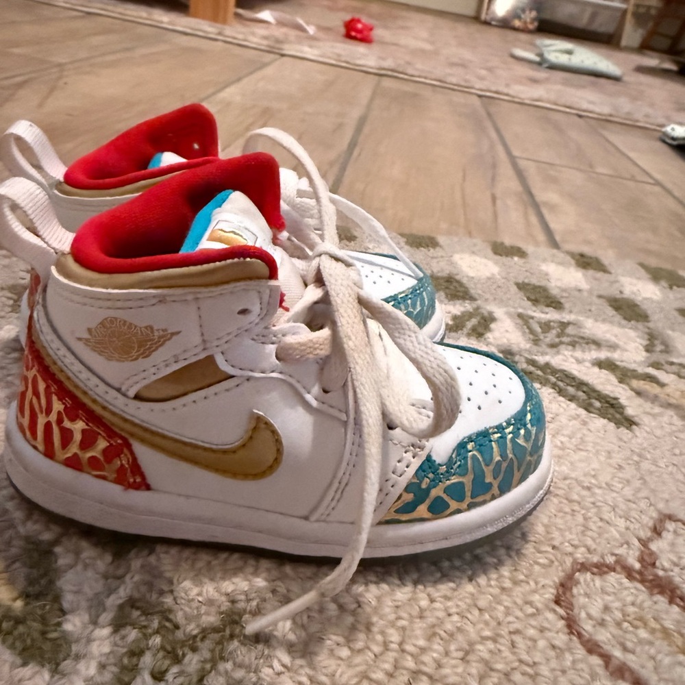 Nike Kids White, Gold, and Red Sneakers